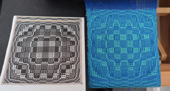 A binary (black and white) grid of a weaving draft on the left, and a weave following it on the right, in blue and peppermint yarn.